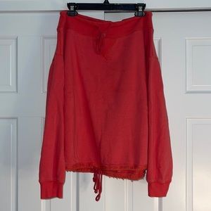 Free People red tunic/ sweatshirt off-the-shoulder.